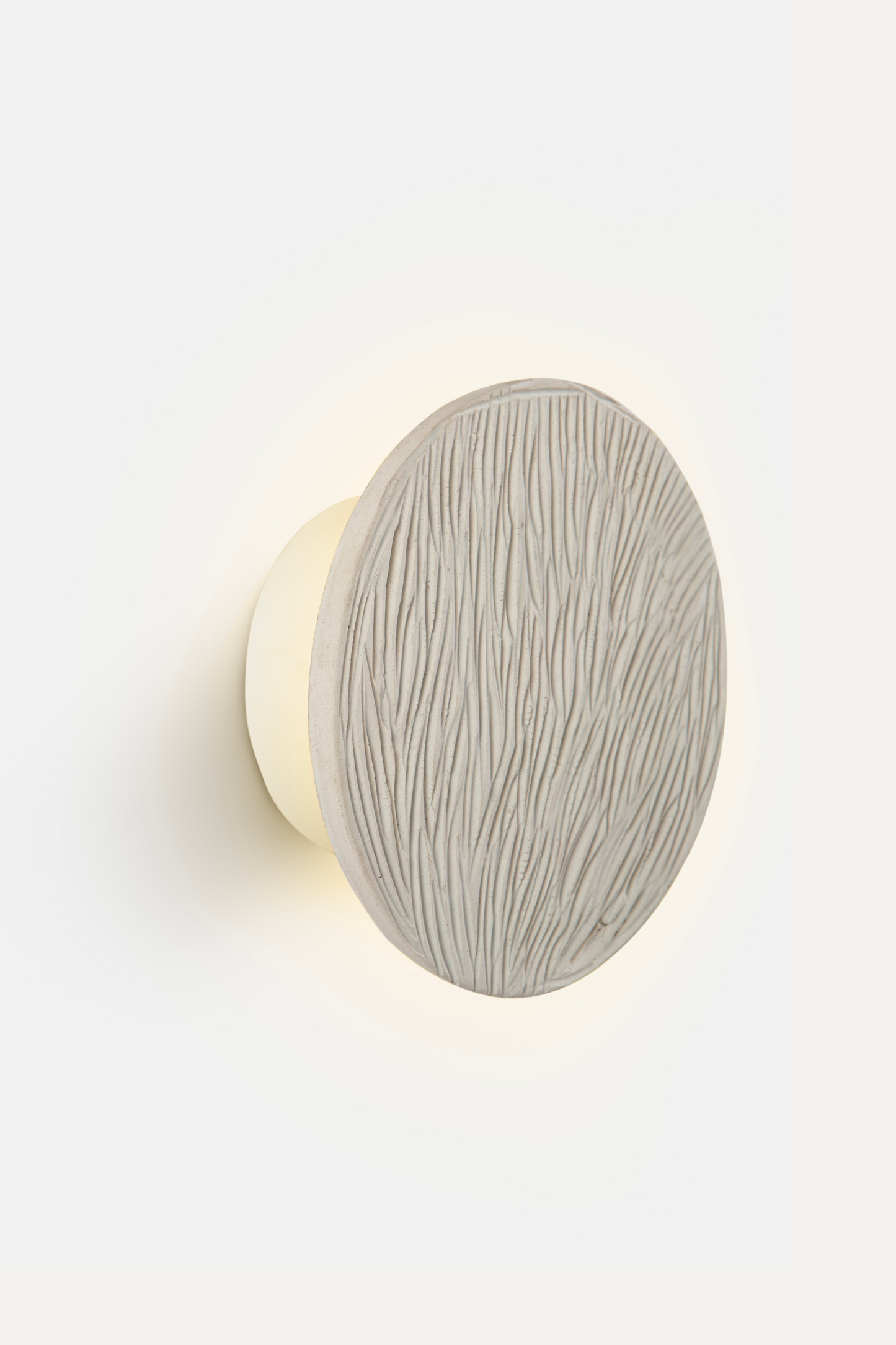Clay disc wall light